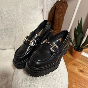 Loafers with gold buckle